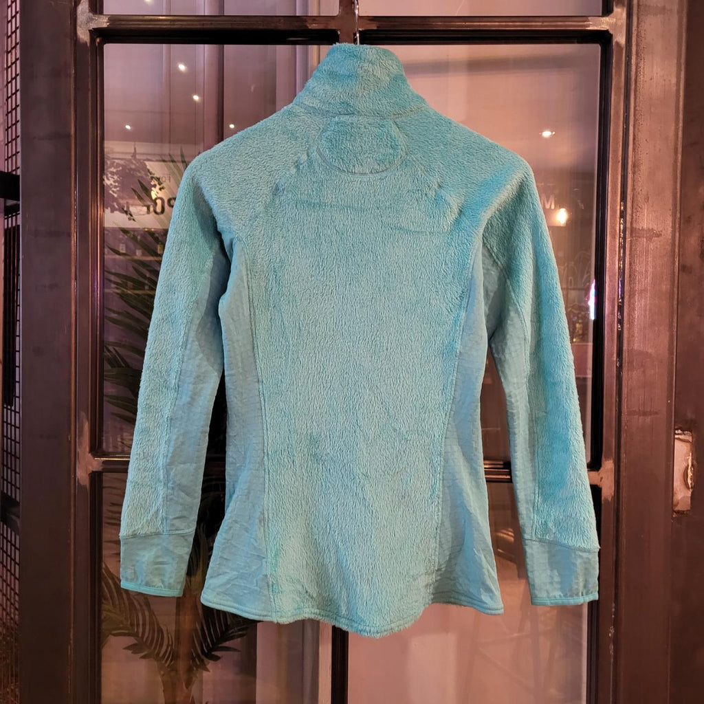 Vintage essential retro Aztec funky geometric tribal block pattern light blue turquiose Patagonia snap T popper quarter zip synchilla fleece sweatshirt pullover with small spellout logo as seen
