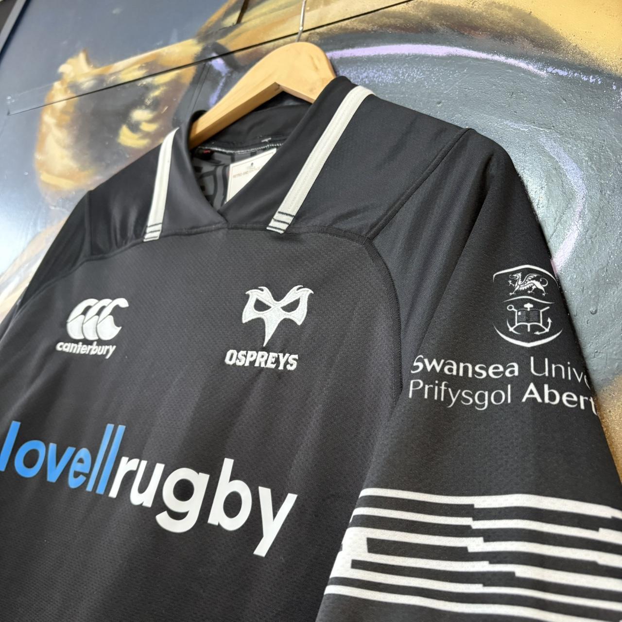 Canterbury Ospreys 2017 - 18 Home Black Collared Rugby Short Sleeve Jersey with embroidered logos and lovellrugby, RNA, Swansea University, morganstone and dezrezlegal printed sponsorships
