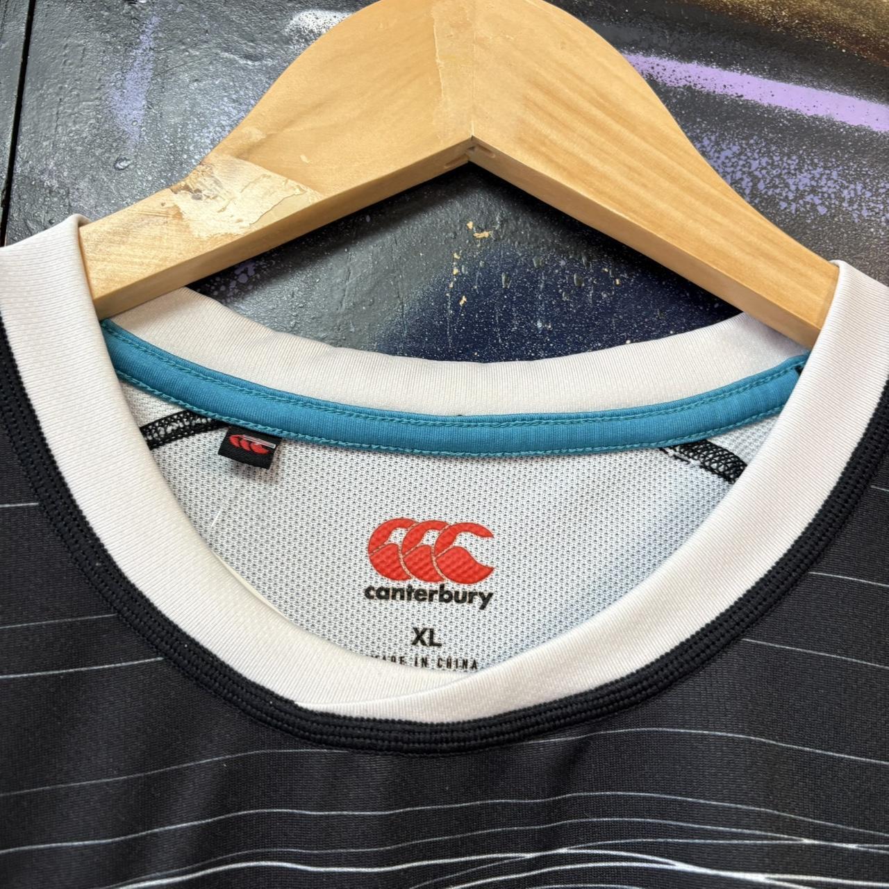 Vintage Retro Essential Canterbury Ospreys 2019 - 2020 Home Black Collared Rugby Short Sleeve Jersey with embroidered logo  and Swansea University, Protecht, Ministry of Furniture, NPTC, Philtronics Limited, morganstone and Keytree printed sponsorships