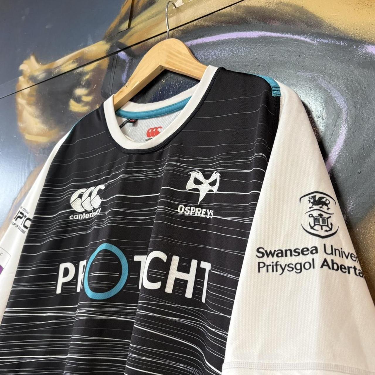 Vintage Retro Essential Canterbury Ospreys 2019 - 2020 Home Black Collared Rugby Short Sleeve Jersey with embroidered logo  and Swansea University, Protecht, Ministry of Furniture, NPTC, Philtronics Limited, morganstone and Keytree printed sponsorships