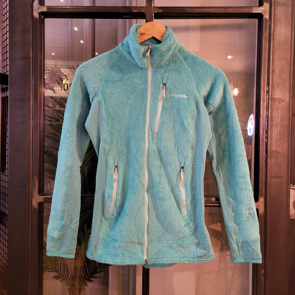 Vintage essential retro Aztec funky geometric tribal block pattern light blue turquiose Patagonia snap T popper quarter zip synchilla fleece sweatshirt pullover with small spellout logo as seen