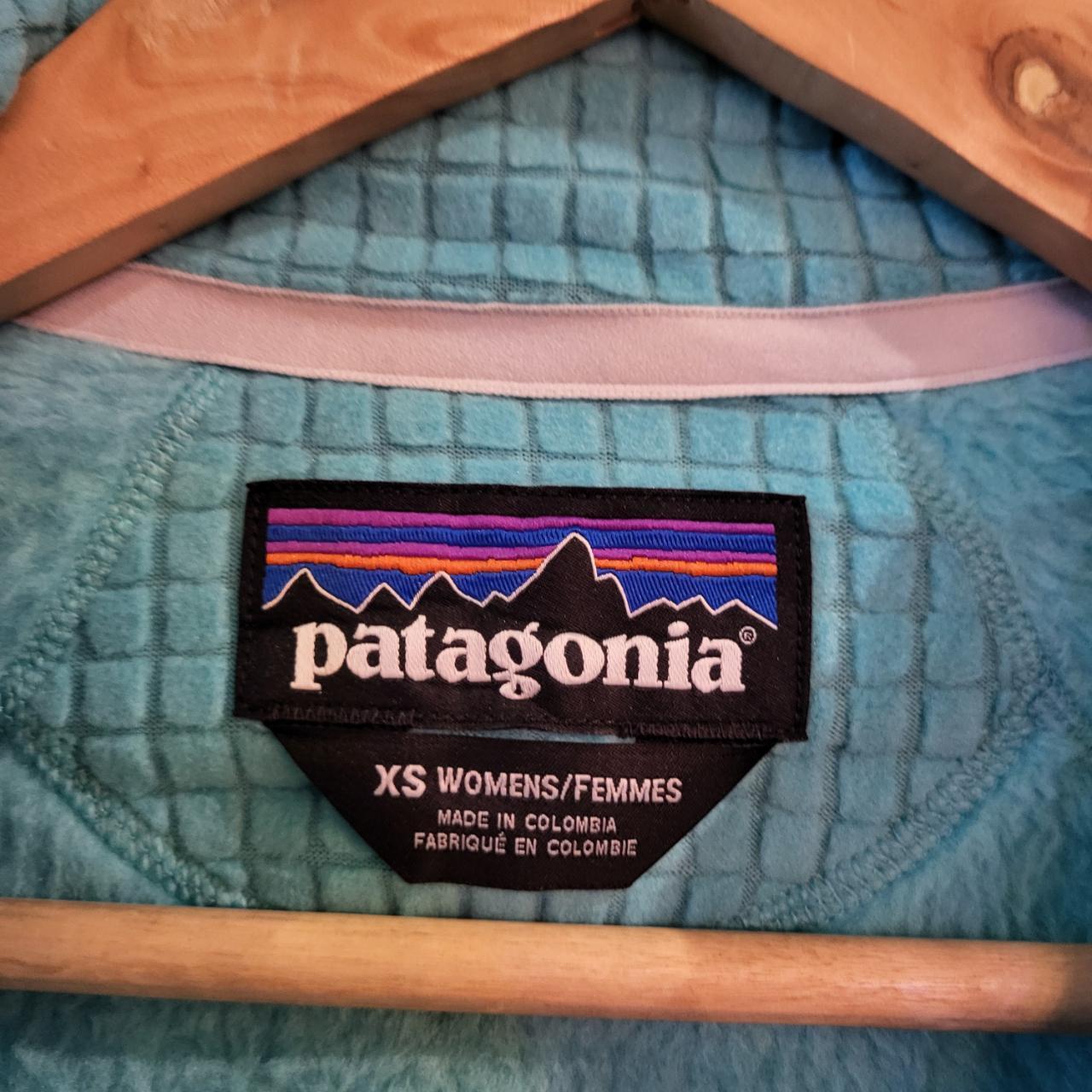 Vintage essential retro Aztec funky geometric tribal block pattern light blue turquiose Patagonia snap T popper quarter zip synchilla fleece sweatshirt pullover with small spellout logo as seen