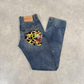 CP2504A-U - Vintage retro essential  Ed Hardy Distressed Studded Blue Wash Denim Jeans Trousers pants with embroidered jaguar and lady pocket patches #studded #embroidered #edhardy #jeans #y2k