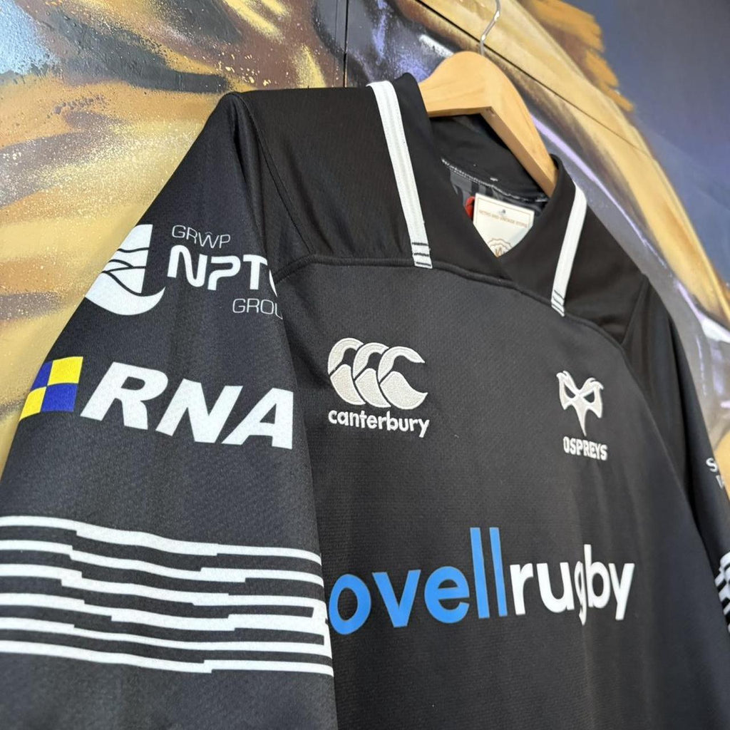 Canterbury Ospreys 2017 - 18 Home Black Collared Rugby Short Sleeve Jersey with embroidered logos and lovellrugby, RNA, Swansea University, morganstone and dezrezlegal printed sponsorships